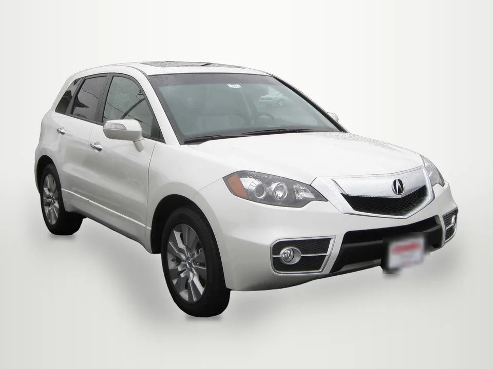 Acura RDX, front three-quarter on a wet lot — edited
